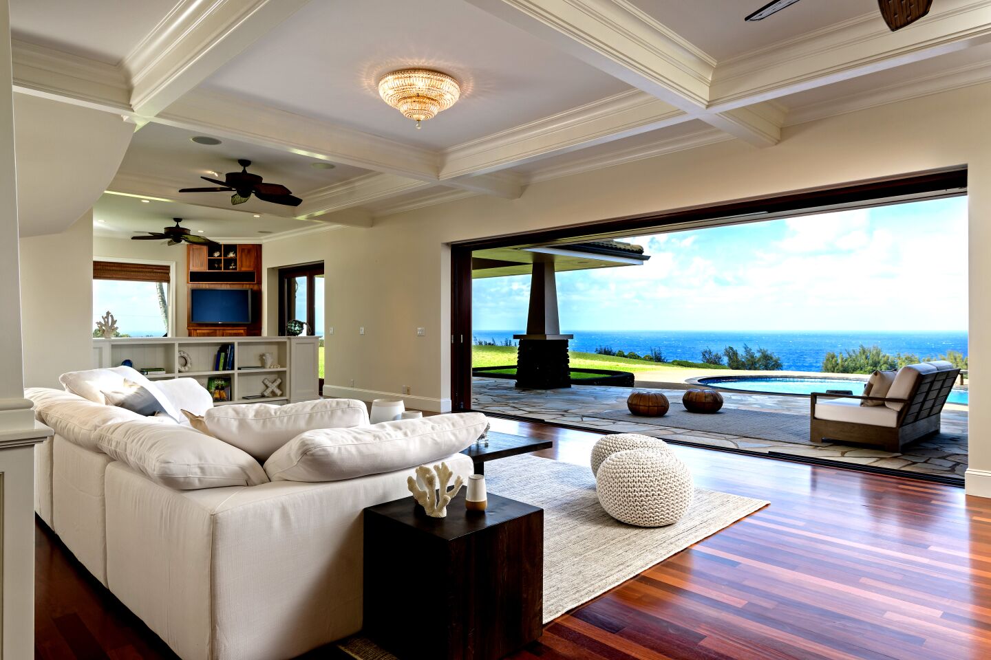 A picture window overlooks the ocean in the formal dining room.