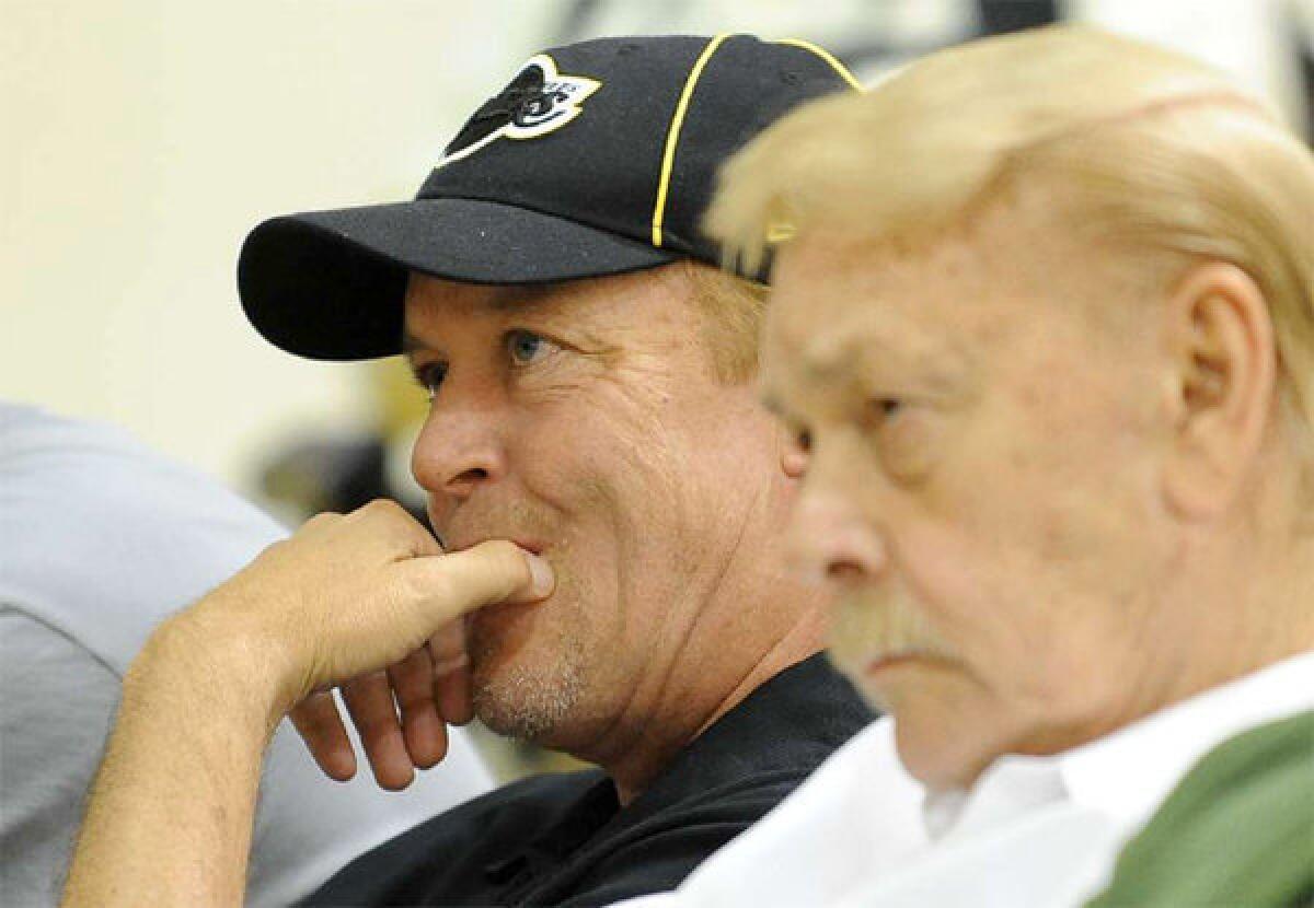 Jim and Jerry Buss. Jim Buss blamed injuries as the primary reason for the Lakers' struggles.