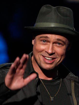 Brad Pitt sports a thin metal chain around his neck during an appearance on Fox's 2008 Idol Gives Back.