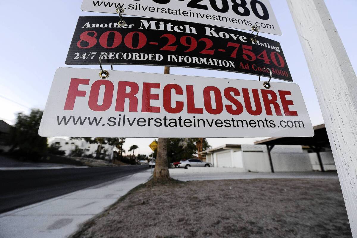 As banks pulled back on lending during the recession, the Federal Housing Administration's role in the market expanded. Now its long-term finances are being dragged down by bad loans it backed from 2007 to 2009. Above, a foreclosure sign at a bank-owned home for sale in Las Vegas in 2010.