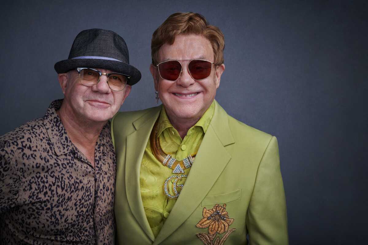Songwriting partners Bernie Taupin, left, and Elton John.