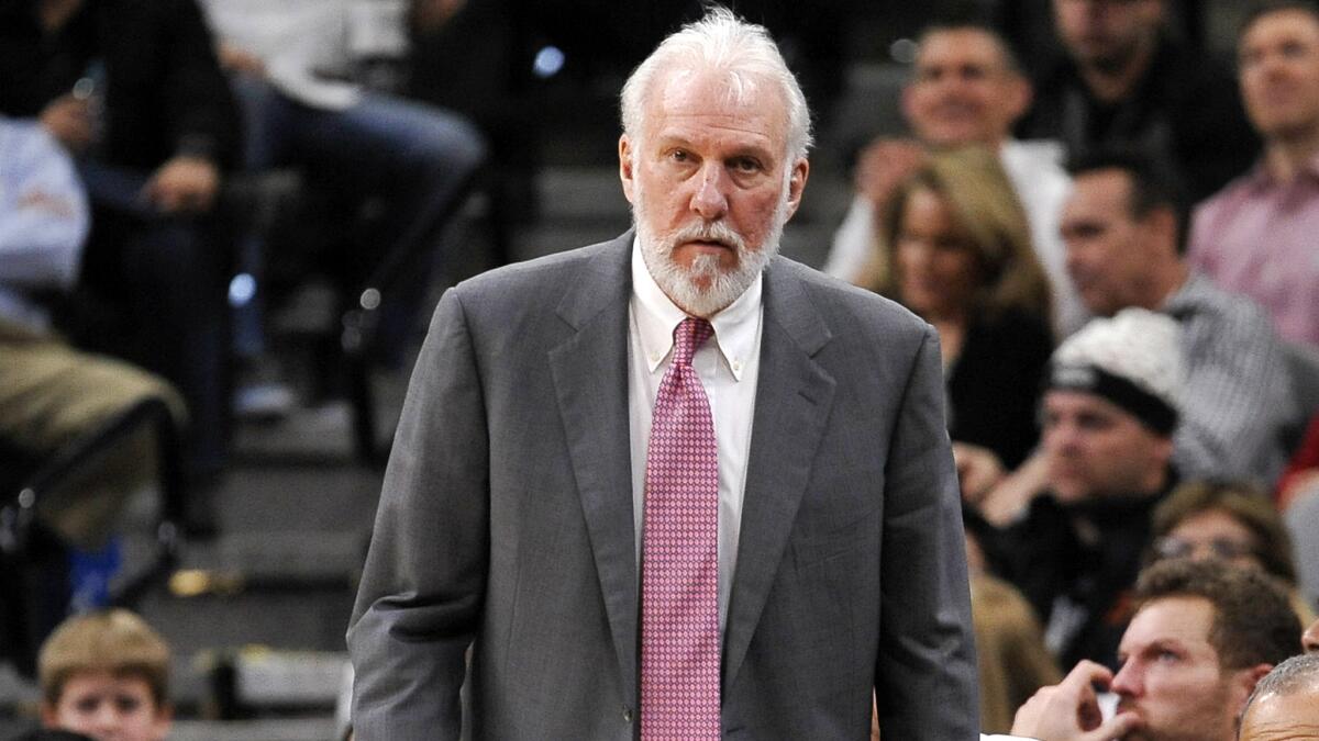 Spurs Coach Gregg Popovich watches play during the second half of San Antonio's victory over the 76ers on Thursday night.