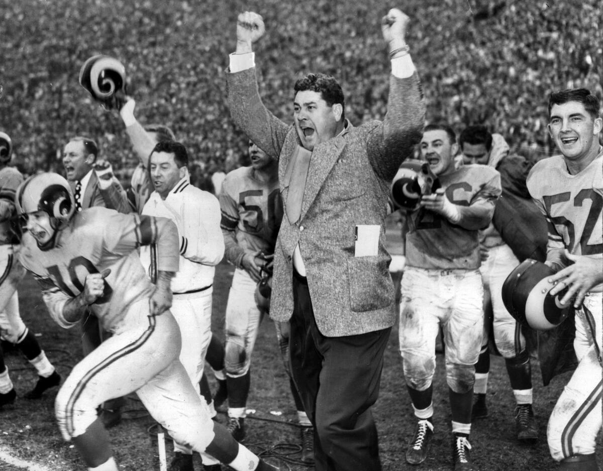 Coach Joe Stydahar and members of the Los Angeles Rams celebrate defeating the Cleveland Browns to win the 1951 NFL Championship at the Los Angeles Memorial Coliseum.