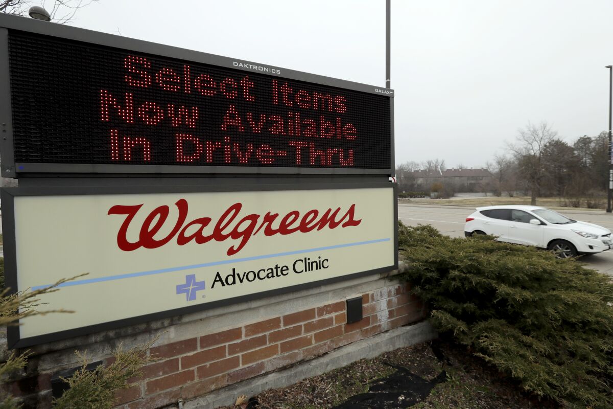 A Walgreens sign is displayed outside the store in Wheeling, Ill.