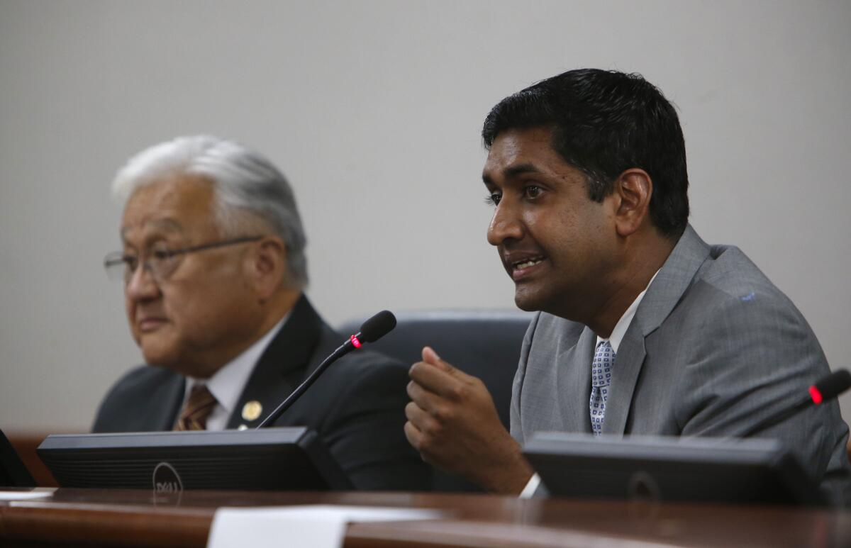 Democrat Ro Khanna, right, speaks a 2014 candidates forum with Rep. Mike Honda (D-San Jose). Khanna is challenging Honda again this year.