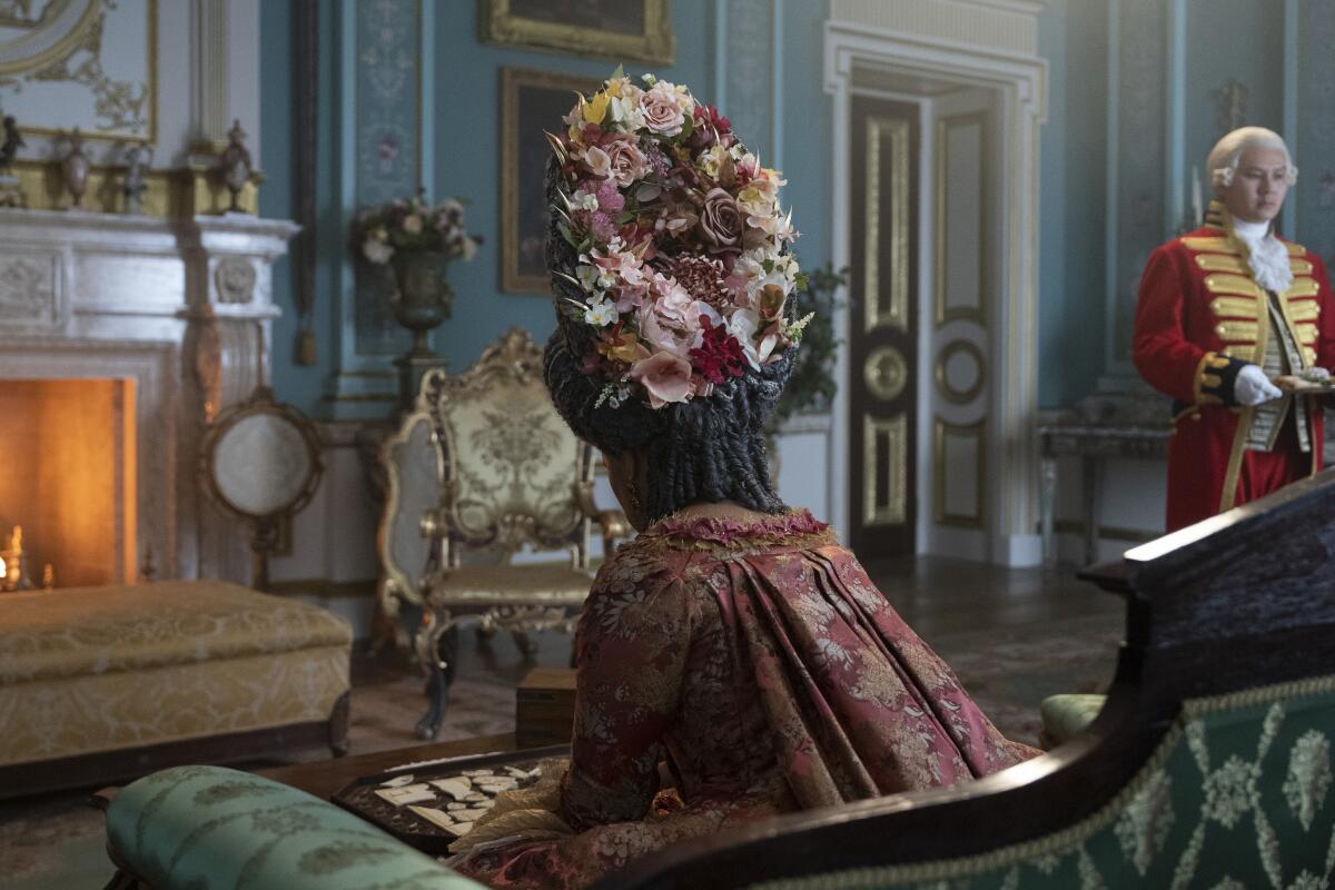 An elaborate floral design adorns a wig worn by Golda Rosheuvel as Queen Charlotte.