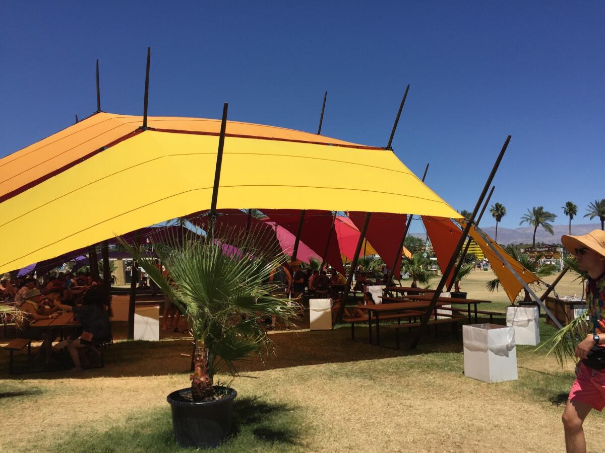 Tent in the shade terrace at Coachella Valley Music and Arts Festival where daily 12-step meetings are held for concert-goers who are in recovery from alcohol or drug addiction.