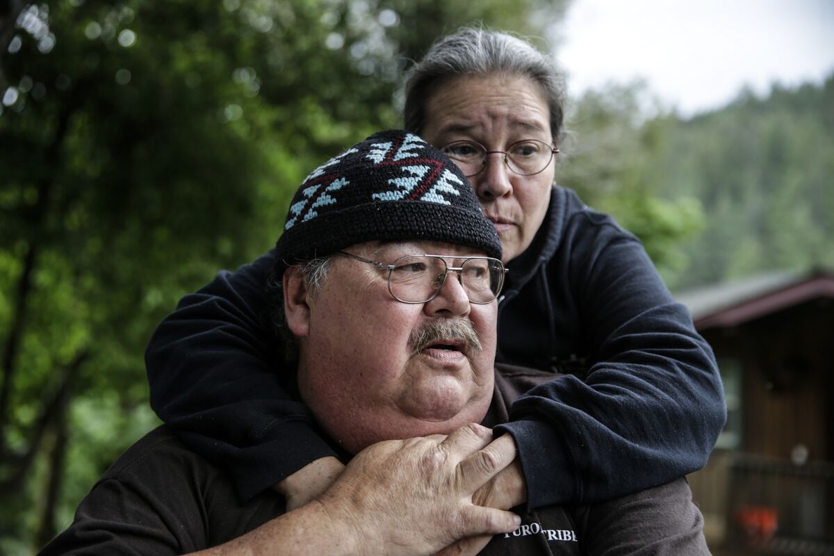 Dan French is comforted by his cousin Elizabeth Azzuz as he talks about his son's suicide.