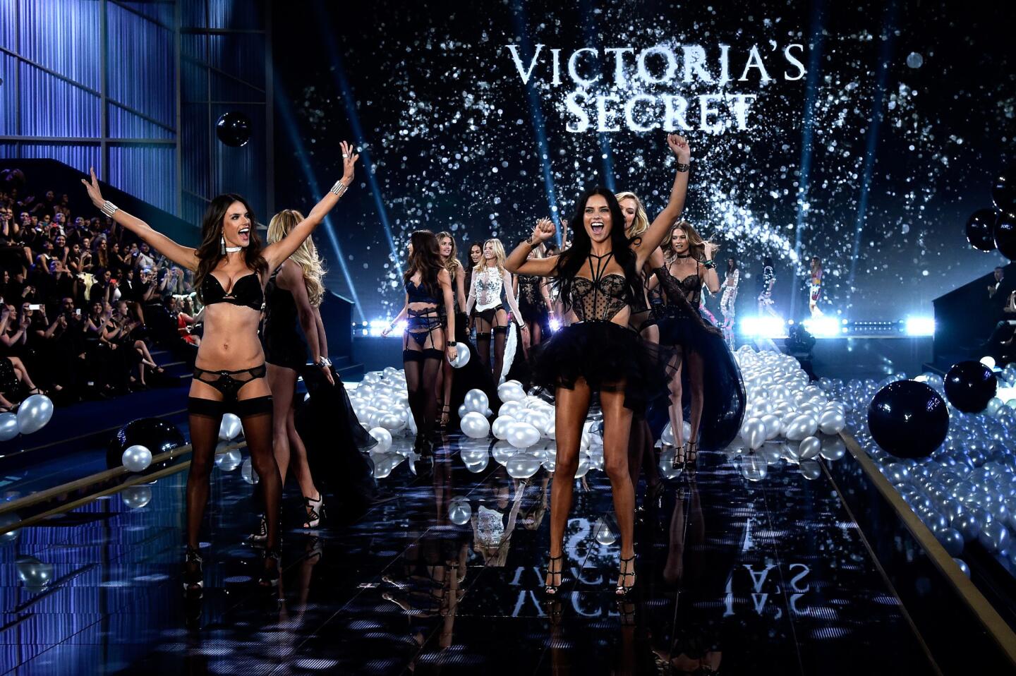 The models storm the runway at Earls Court in London at the 2014 Victoria's Secret Fashion Show.