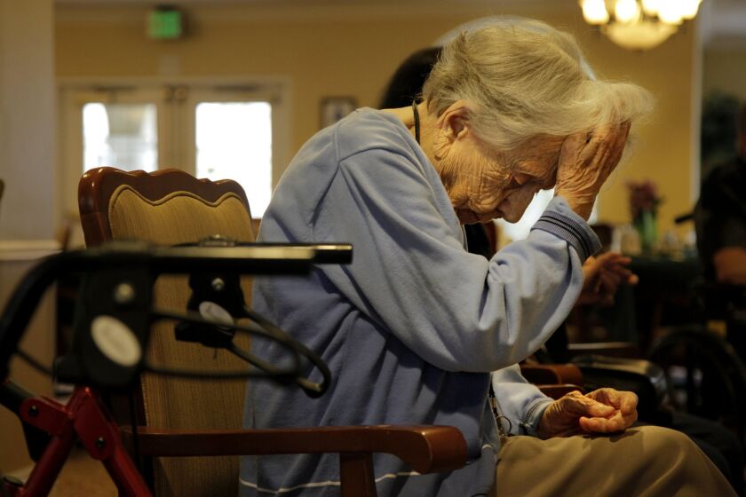 Alice Frazier, 103, rests between exercises in the lobby of Emeritus Carlsbad Wednesday. For many of the seniors living at the Emeritus Carlsbad facility, exercise and other activities like puzzles and bingo are part of their daily activity options.