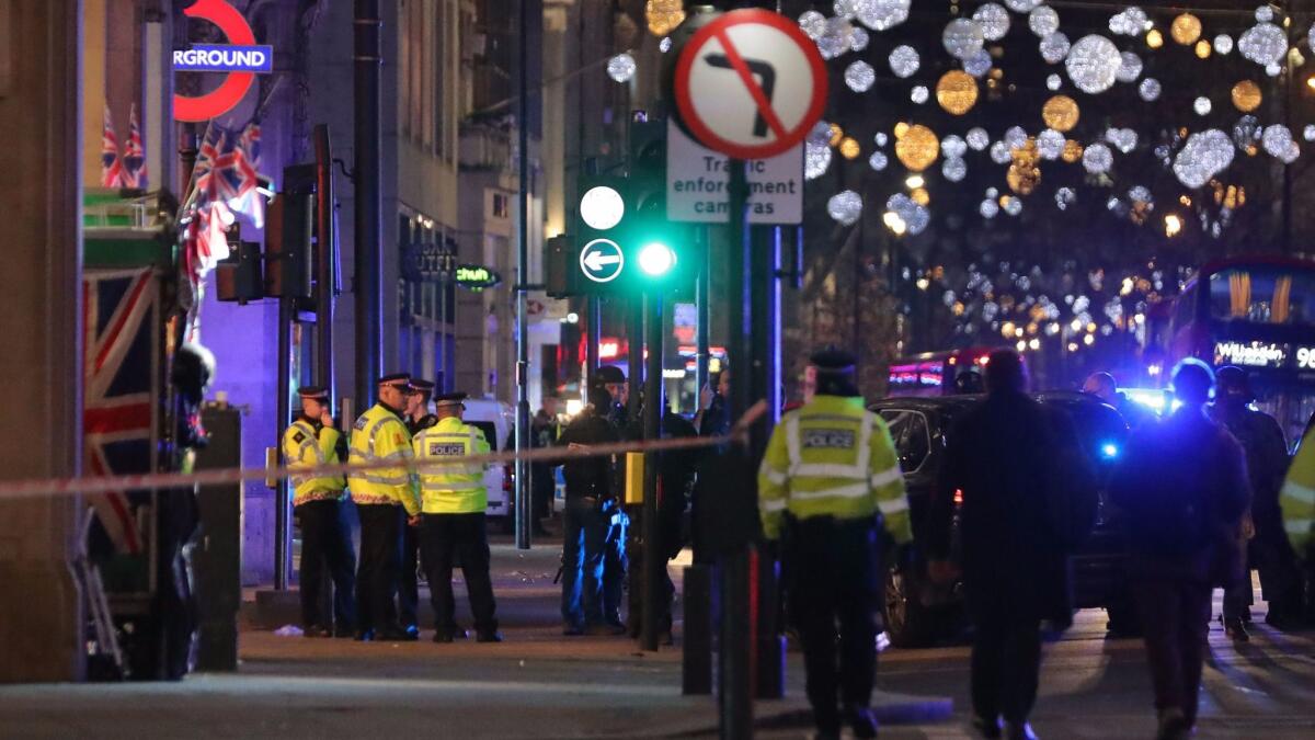 Police set up a cordon outside the Oxford Circus underground station in central London where gunfire was reported on Friday.