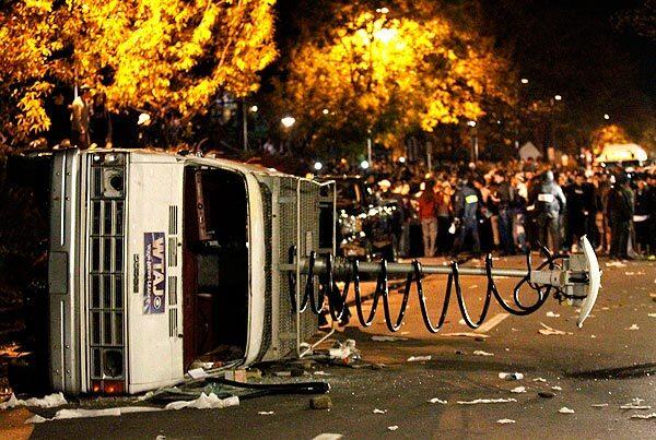 A news van was toppled by protesters.