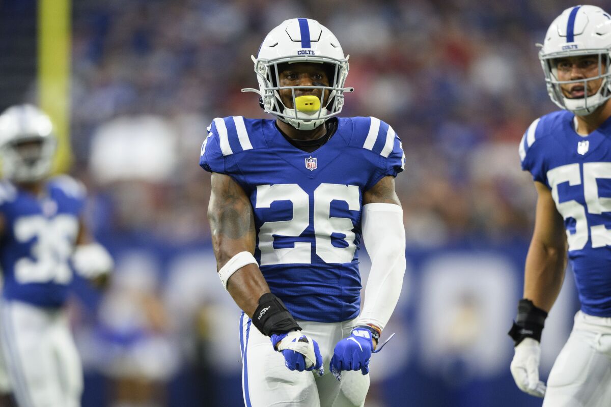 Indianapolis Colts safety Rodney McLeod (26) flexes after a tackle during an NFL football game against the Tampa Bay Buccaneers, Saturday, Aug. 27, 2022, in Indianapolis. (AP Photo/Zach Bolinger)