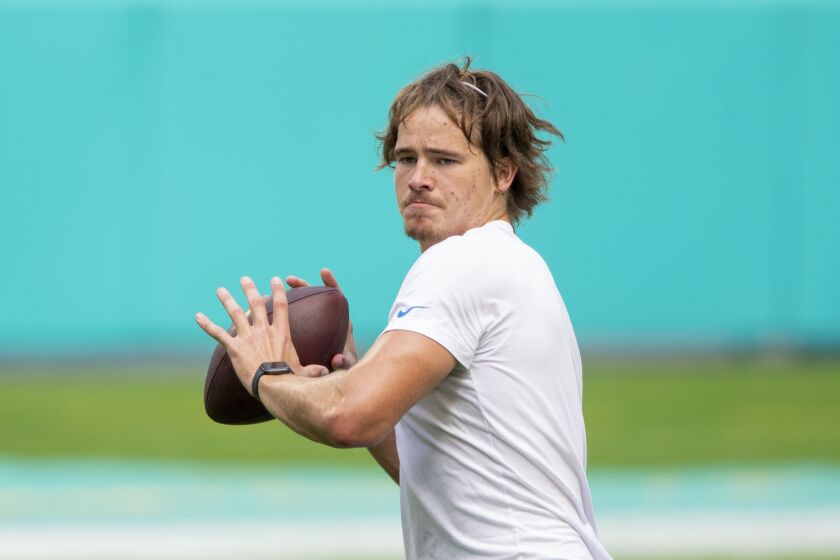 Los Angeles Chargers quarterback Justin Herbert (10) throws the ball as he warms up on the field before taking on the Miami Dolphins during an NFL football game, Sunday, Nov. 15, 2020, in Miami Gardens, Fla. (AP Photo/Doug Murray)