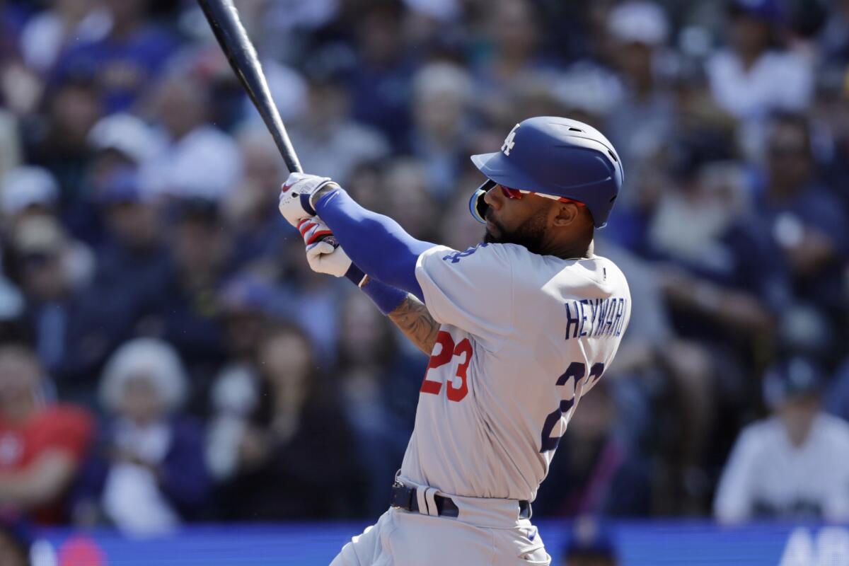 Dodgers' Jason Heyward hits an RBI single against the Seattle Mariners on Sept. 17, 2023, in Seattle.