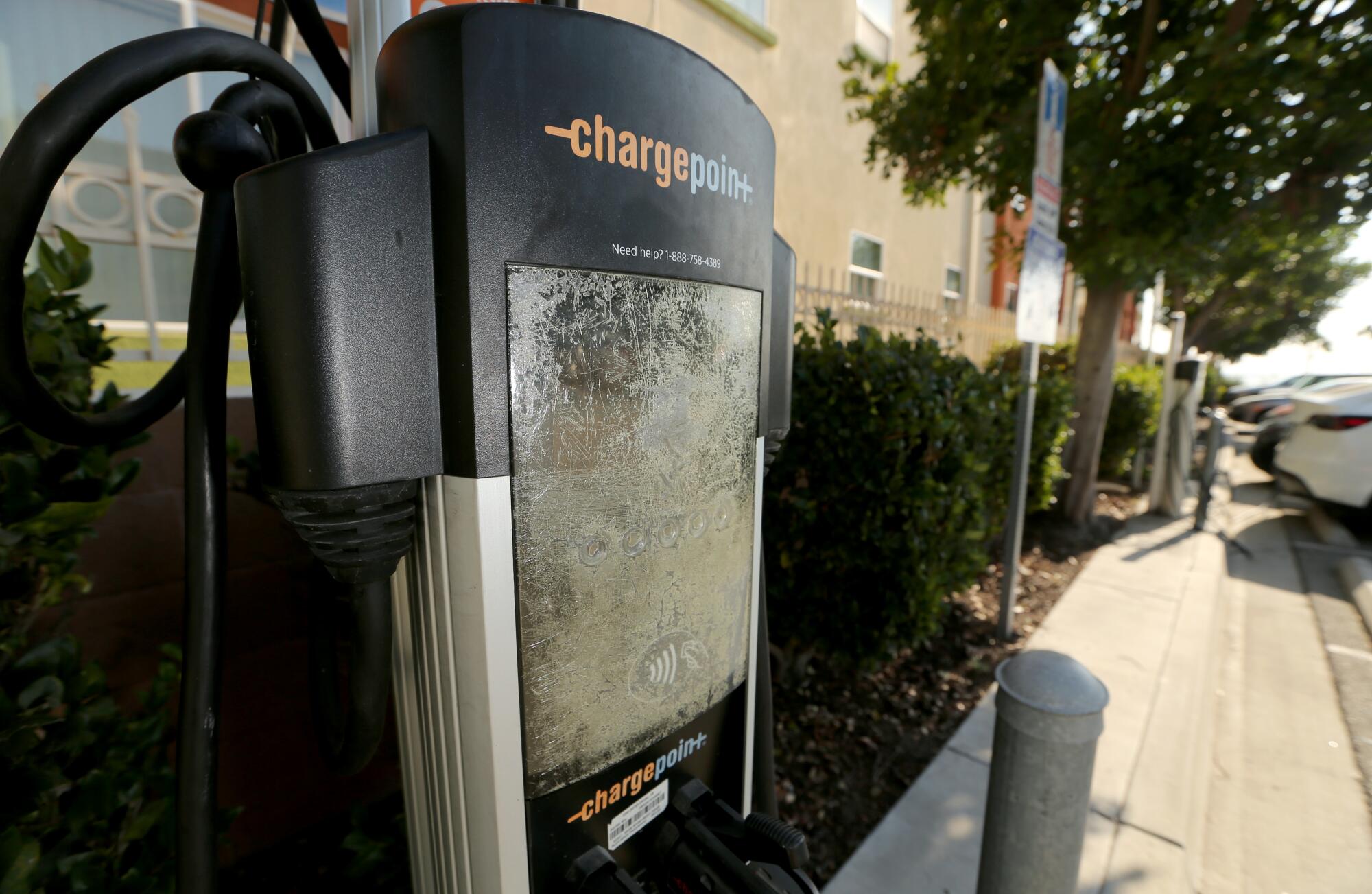 A ChargePoint charger with a cracked, unreadable screen.
