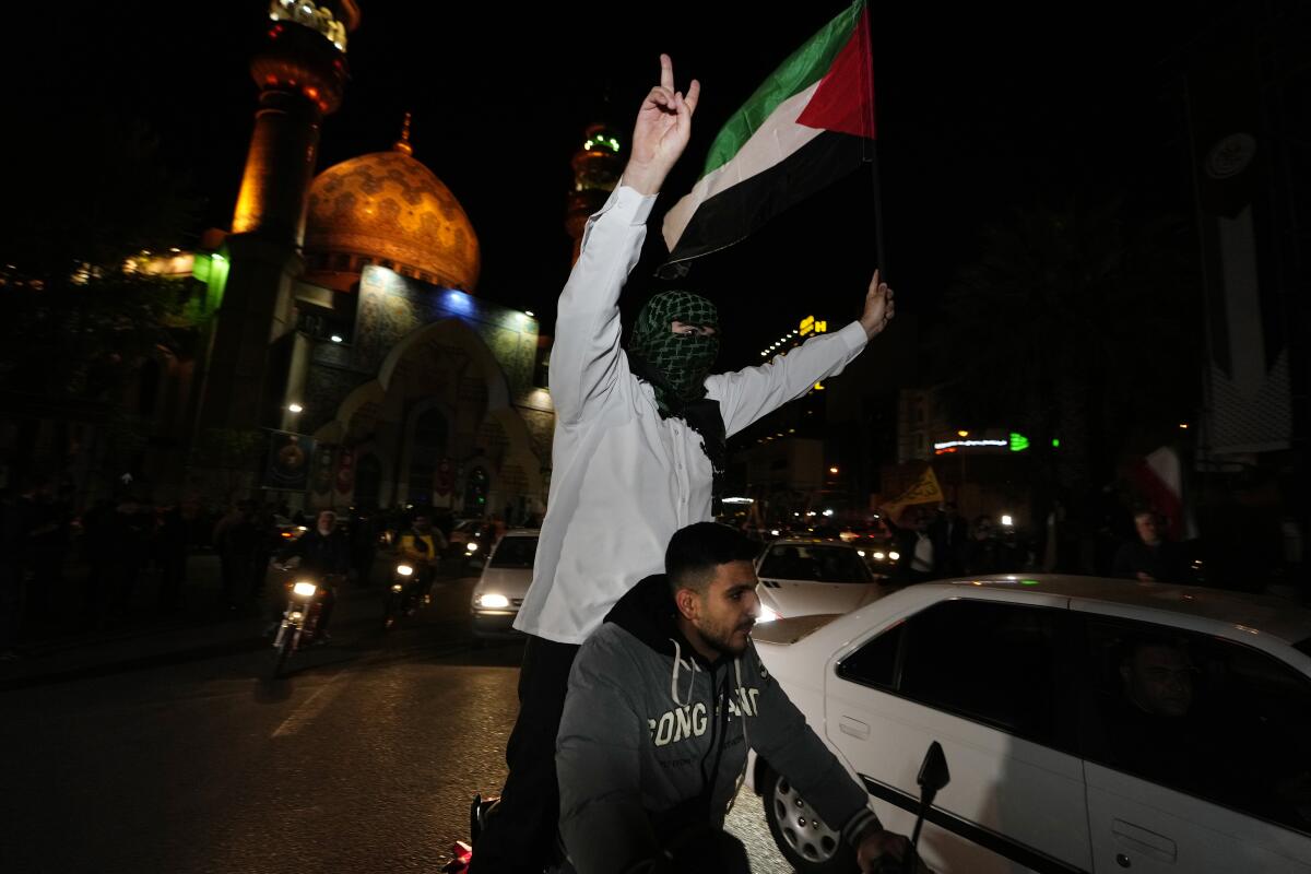 Iranian demonstrators wave a Palestinian flag in Tehran