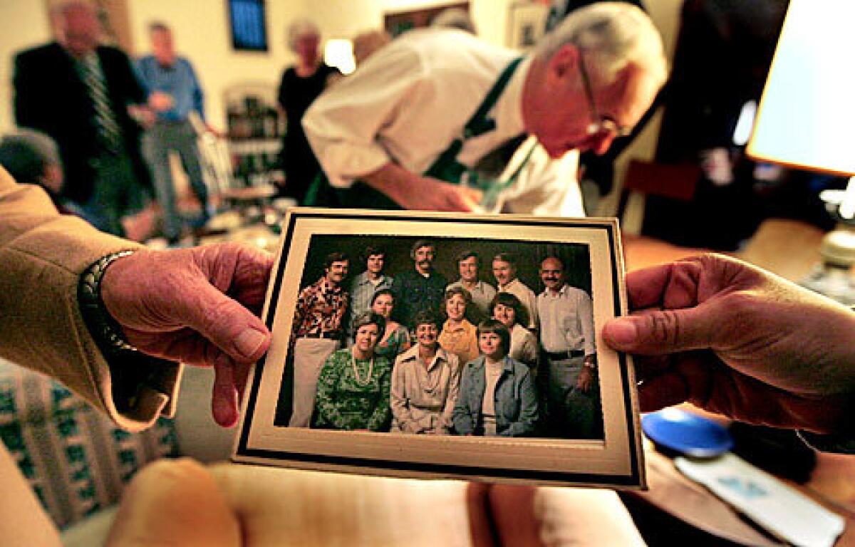 SPANNING TIME: The attire of Food Club members has changed since the early days of their dinners, but the friendships endure.