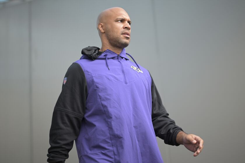 Baltimore Ravens safeties coach D'Anton Lynn walks to the field before an NFL football game against the Jacksonville Jaguars, Sunday, Nov. 27, 2022, in Jacksonville, Fla. (AP Photo/Phelan M. Ebenhack)