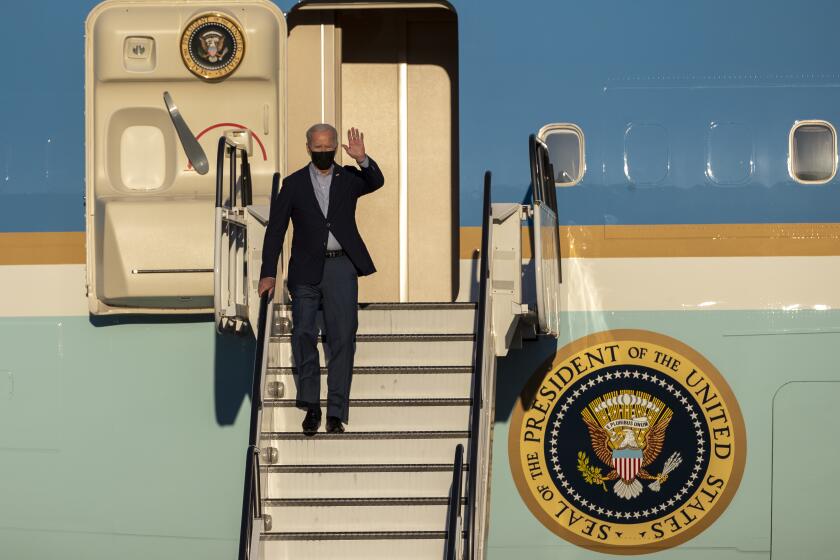 LONG BEACH, CA - September 13, 2021: President Biden disembarks Air Force One after landing at Long Beach Airport to attend a "No on Recall" rally with Gov. Gavin Newsom the night before the recall election in Long Beach, California.(Gina Ferazzi / Los Angeles Times)