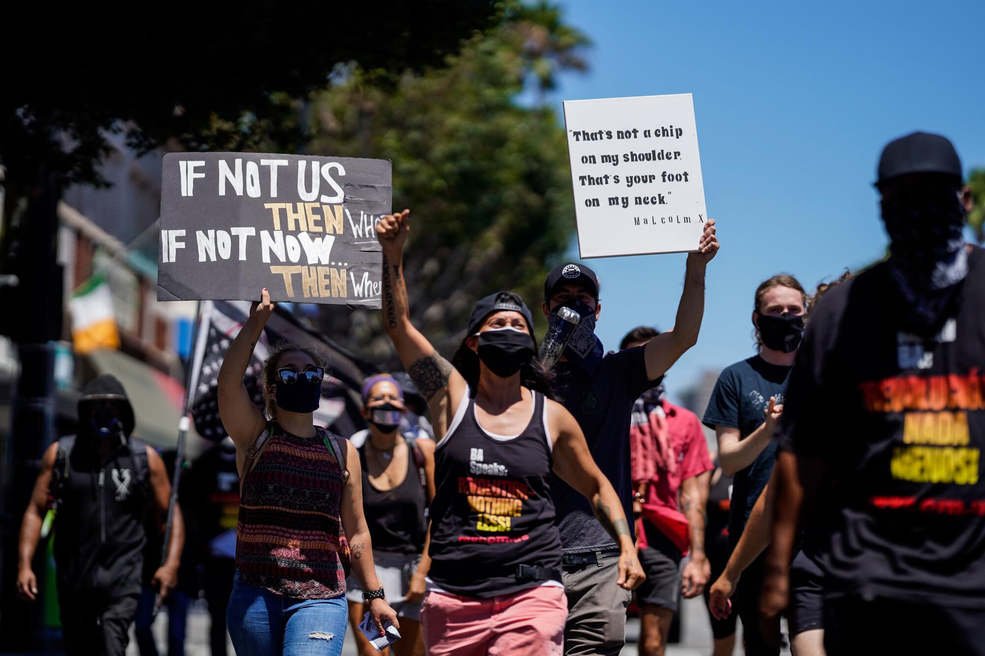 Protesters march thru Hollywood, part of the "Demonstrate How to Dishonor the American Flag" event.