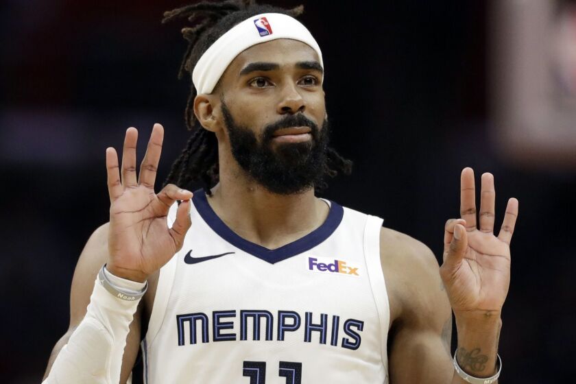 Memphis Grizzlies' Mike Conley gestures after making a 3-point basket against the Los Angeles Clippers during the second half of an NBA basketball game Friday, Nov. 23, 2018, in Los Angeles. (AP Photo/Marcio Jose Sanchez)