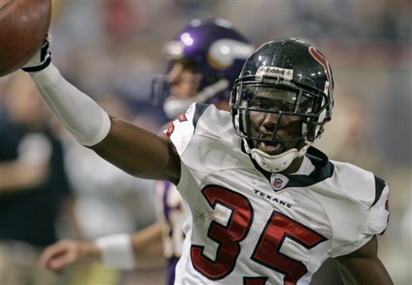 Houston Texans cornerback Jacques Reeves celebrates his touchdown after intercepting a pass by Minnesota Vikings quarterback Gus Frerotte in the first quarter of an NFL football game Sunday, Nov. 2, 2008, in Minneapolis. (AP Photo/Jim Mone)