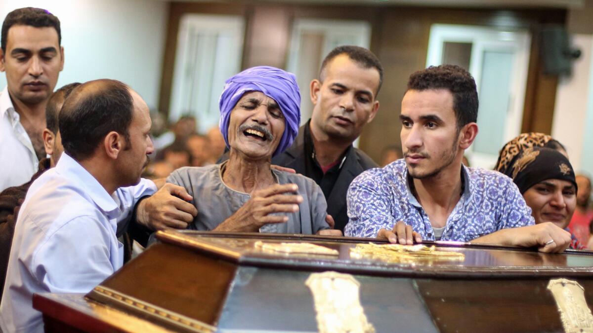 Relatives and friends of Christian Assad Labib, 35, mourn at his funeral at the Anglican Church in Sawaada village near Minya after the Islamic State ambush.