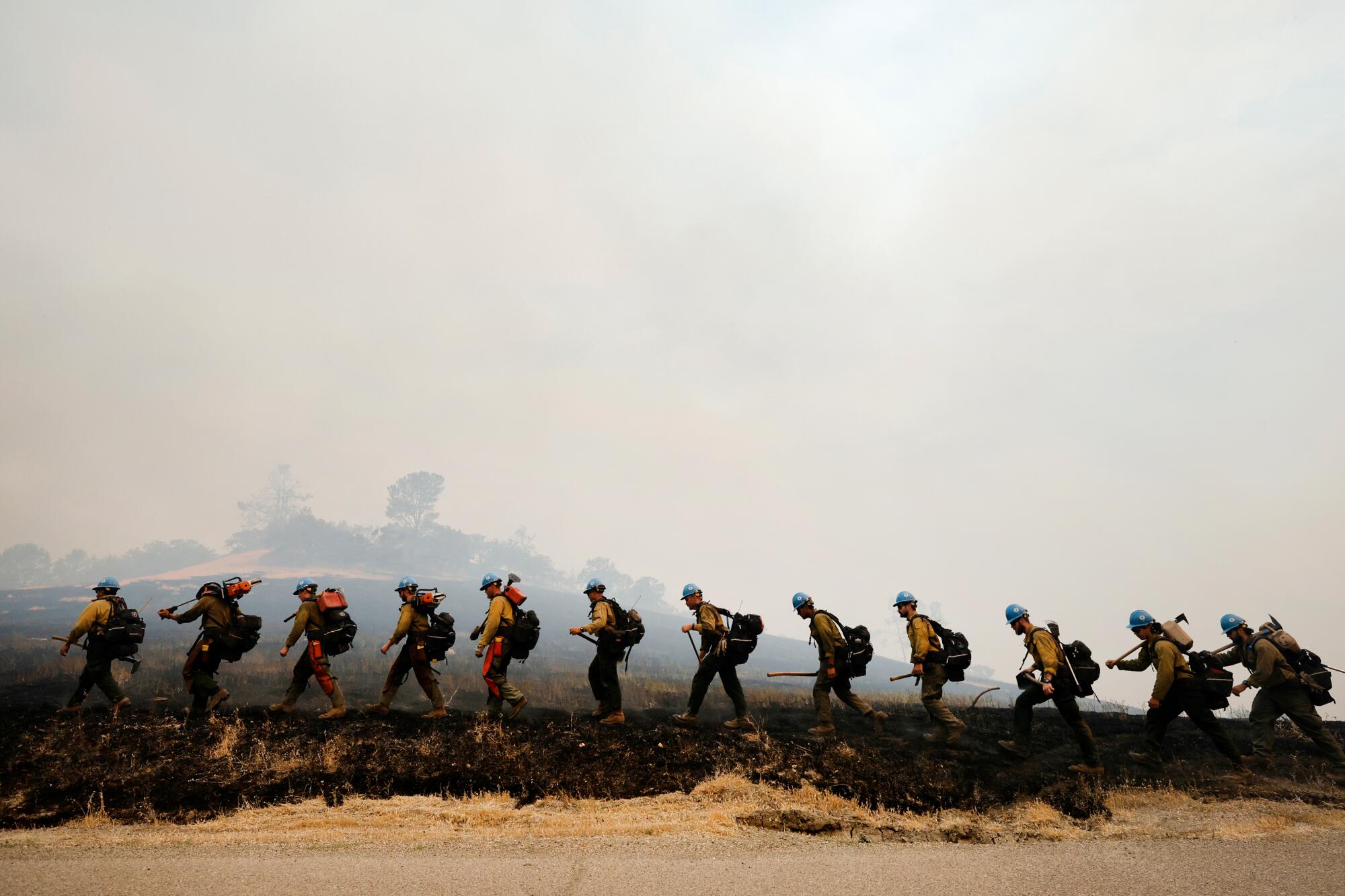 Members of the Arrowhead Hot Shot crew build a fire line as they continue to fight the Lake Fire, in Santa Barbara County.