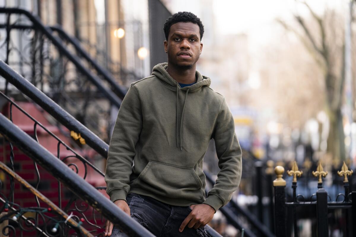 Mikel Haye poses for a portrait on his stoop