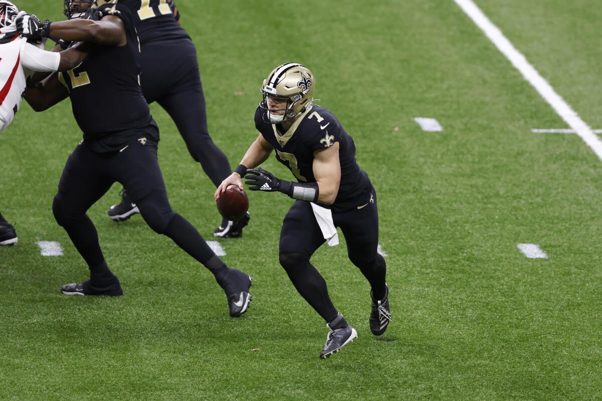 New Orleans Saints quarterback Taysom Hill looks to pass against the Atlanta Falcons on Sunday.