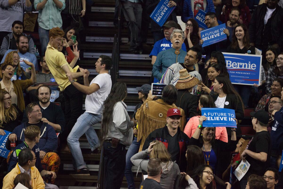 Fans dance in the aisles before Bernie Sanders' arrival at a Seattle rally this week.
