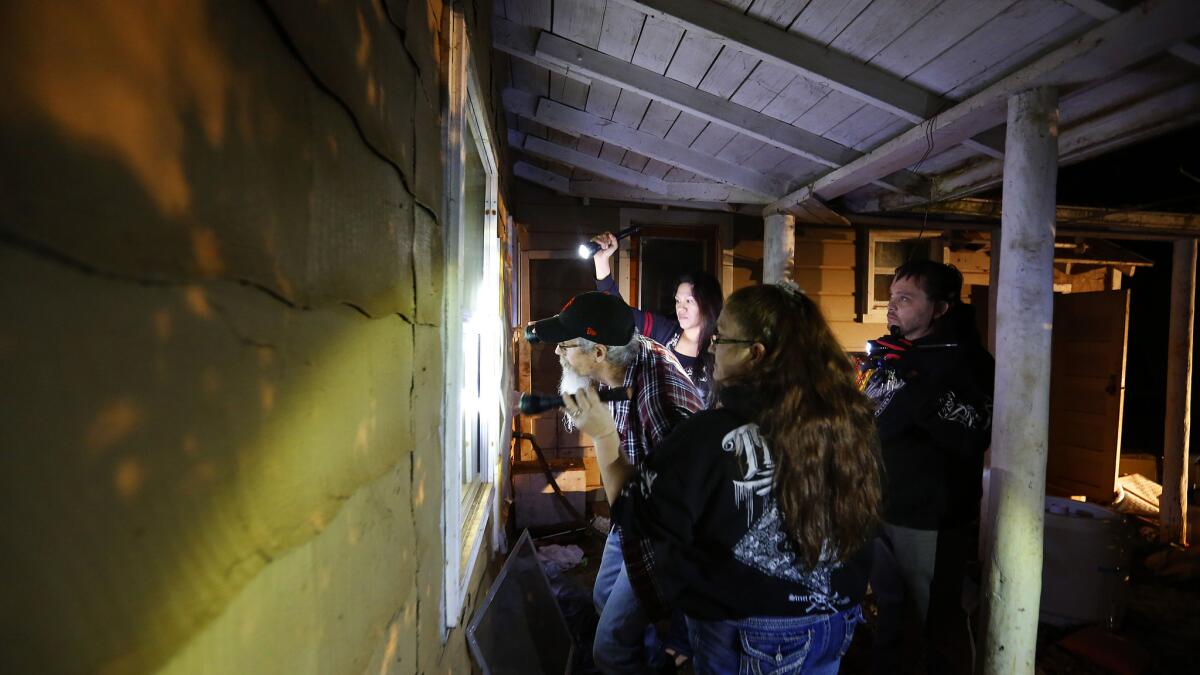 Cave Junction residents on volunteer patrol check an abandoned home where meth users have taken up residence.