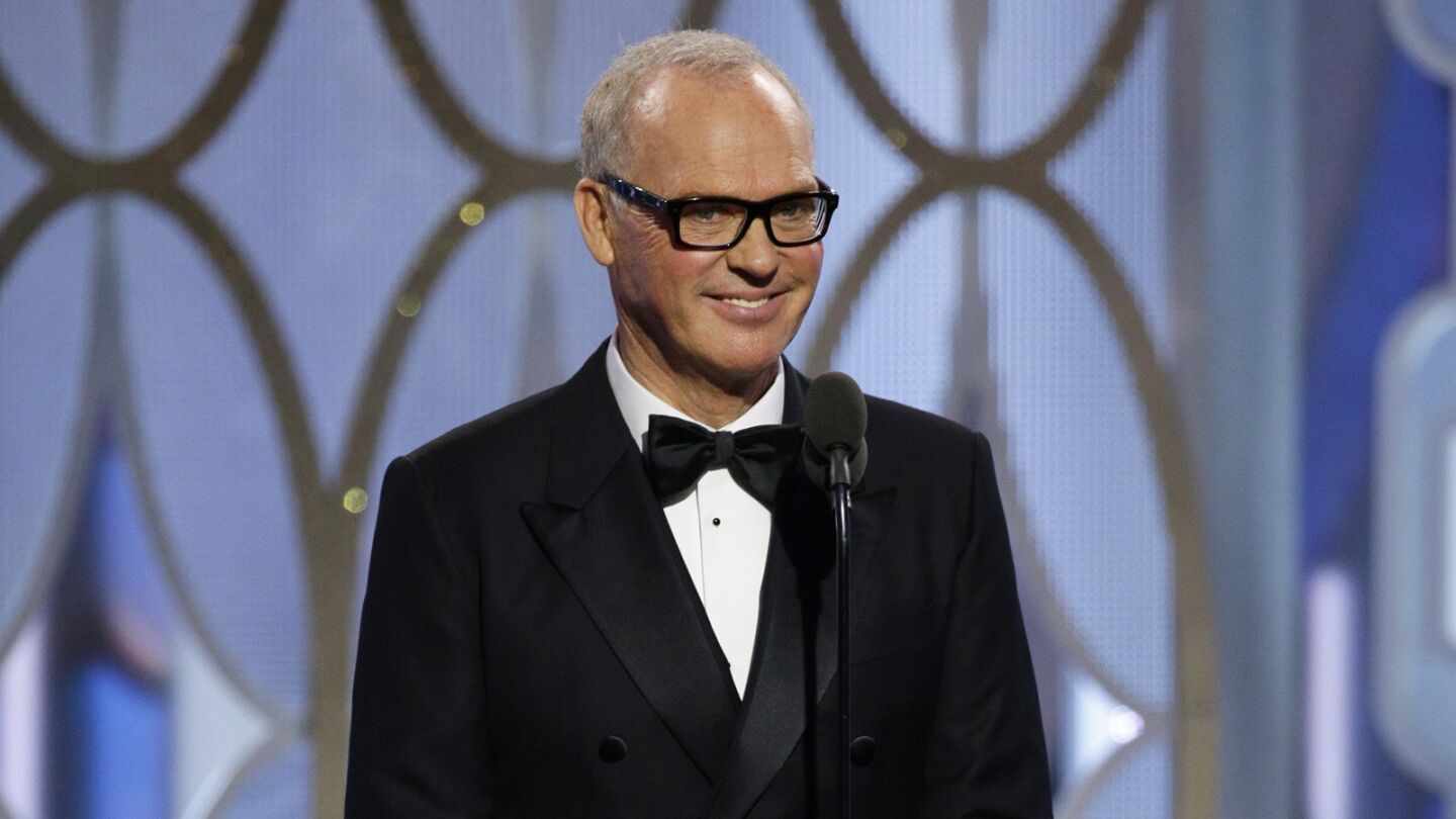 Michael Keaton takes the stage to present an award.