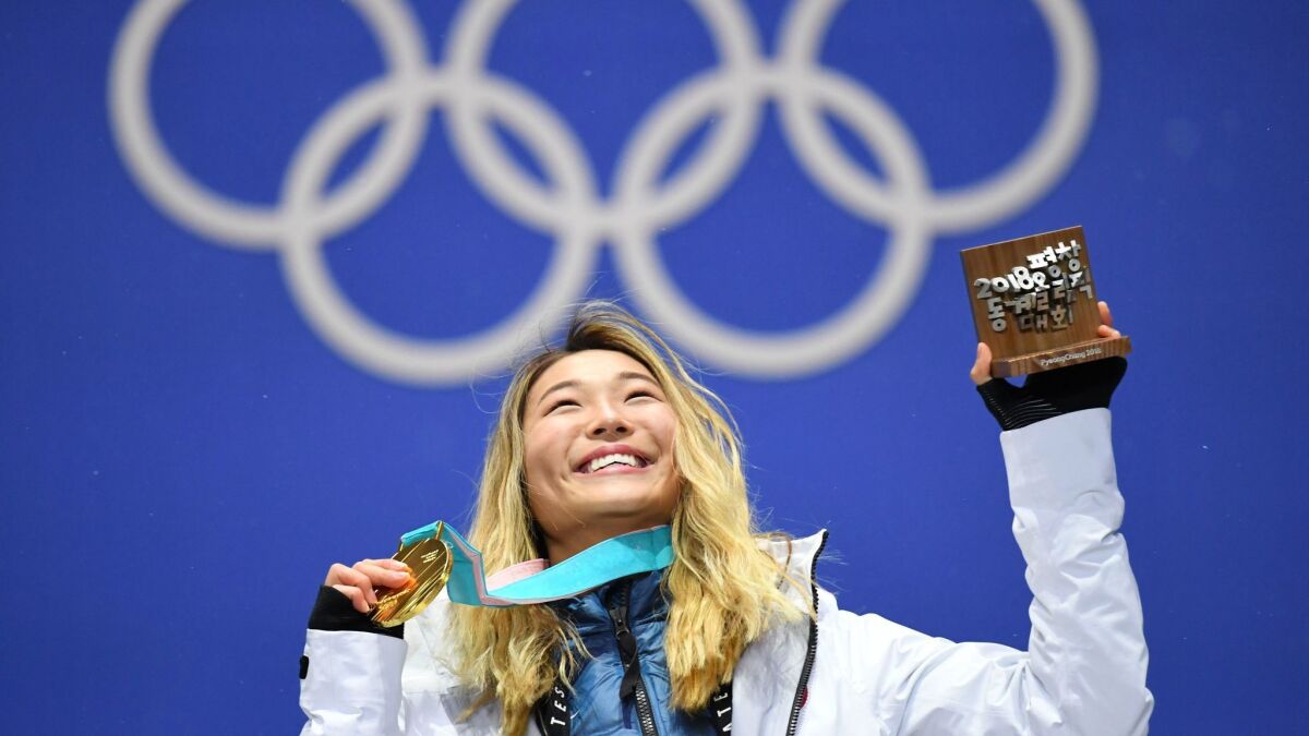 Women's halfpipe gold medalist Chloe Kim on the podium during the medal ceremony Tuesday in South Korea.