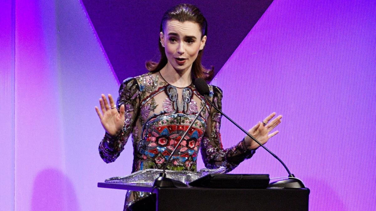 Actress Lily Collins accepts the Lacoste Spotlight Award during the 19th Costume Designers Guild Awards.