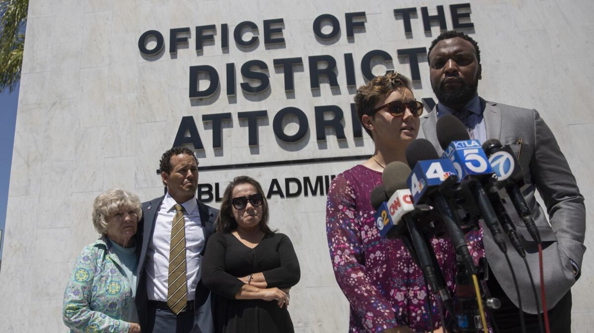Nyla Williams, 19, the sister of Hannah Williams, speaks at a news conference outside the Orange County district attorney's office on Thursday. At right is civil rights attorney S. Lee Merritt, and her family listens in the back.