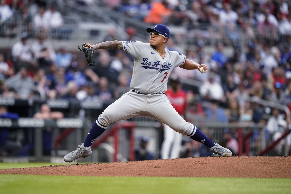 Los Angeles Dodgers starting pitcher Julio Urias delivers to an Atlanta Braves.