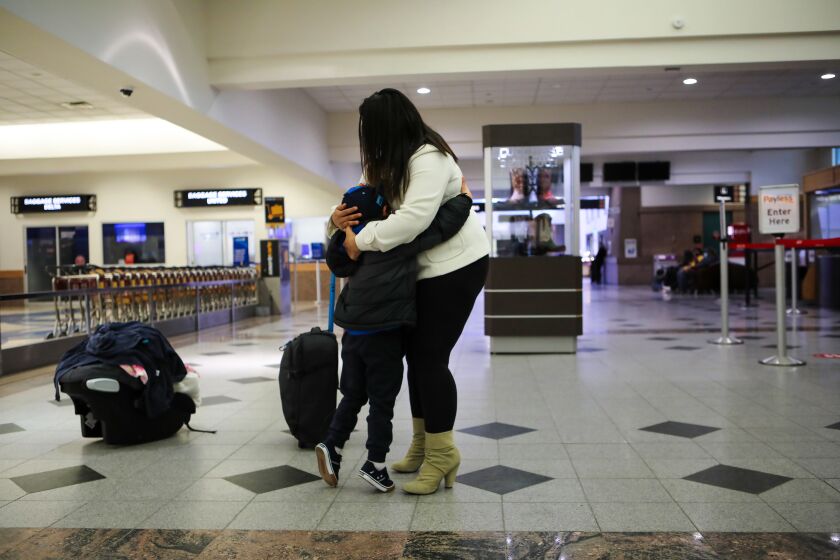 A young Honduran asylum seeking mother is reunited with her five year old son on March 24, 2021 at the El Paso International Airport in Texas after being apart for nearly a month. Her son came to the United States with his uncle but was separated and put in a shelter in Texas and later transferred to New York. (J.R. Hernandez/ Los Angeles Times)
