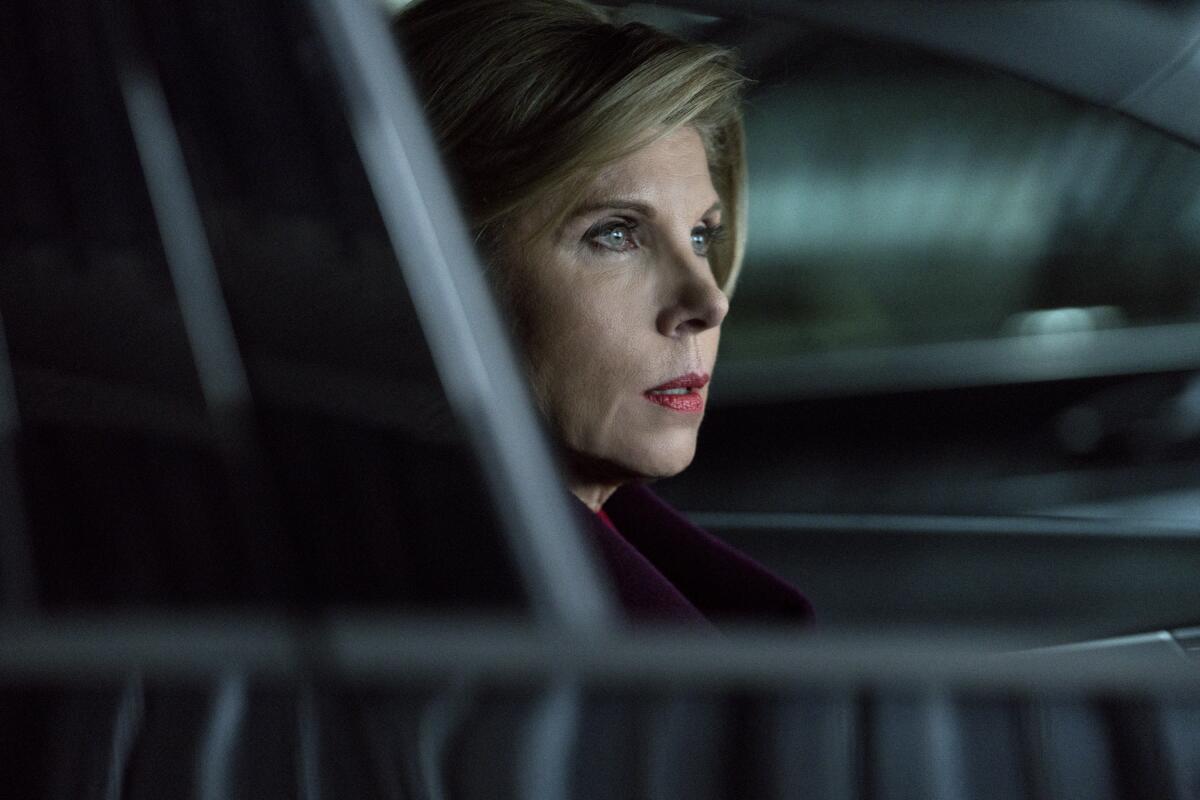 A woman sits in a car in a scene from "The Good Fight."
