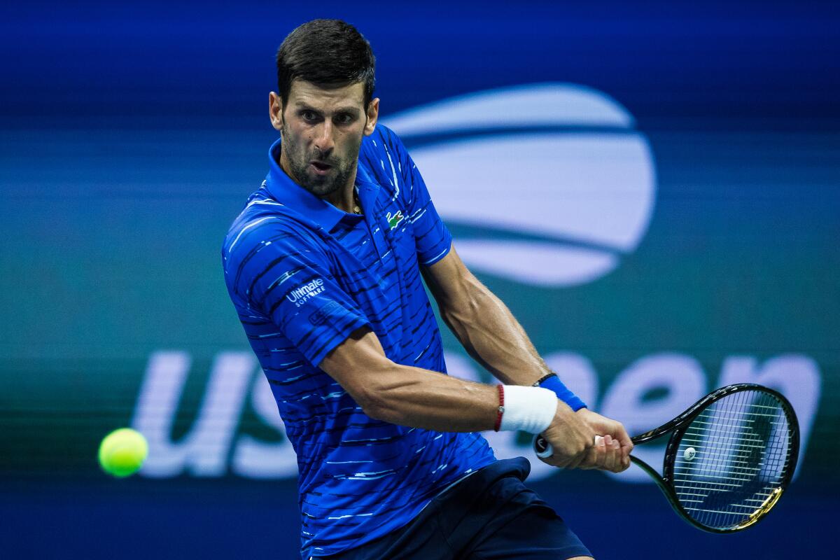 Novak Djokovic hits a return during his straight-sets victory over Denis Kudla on Aug. 30.