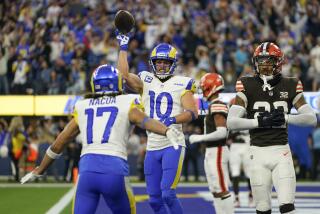 Rams Cooper Kupp (10) and Puka Nacua (17) celebrate a touchdown catch against the Cleveland Browns. 