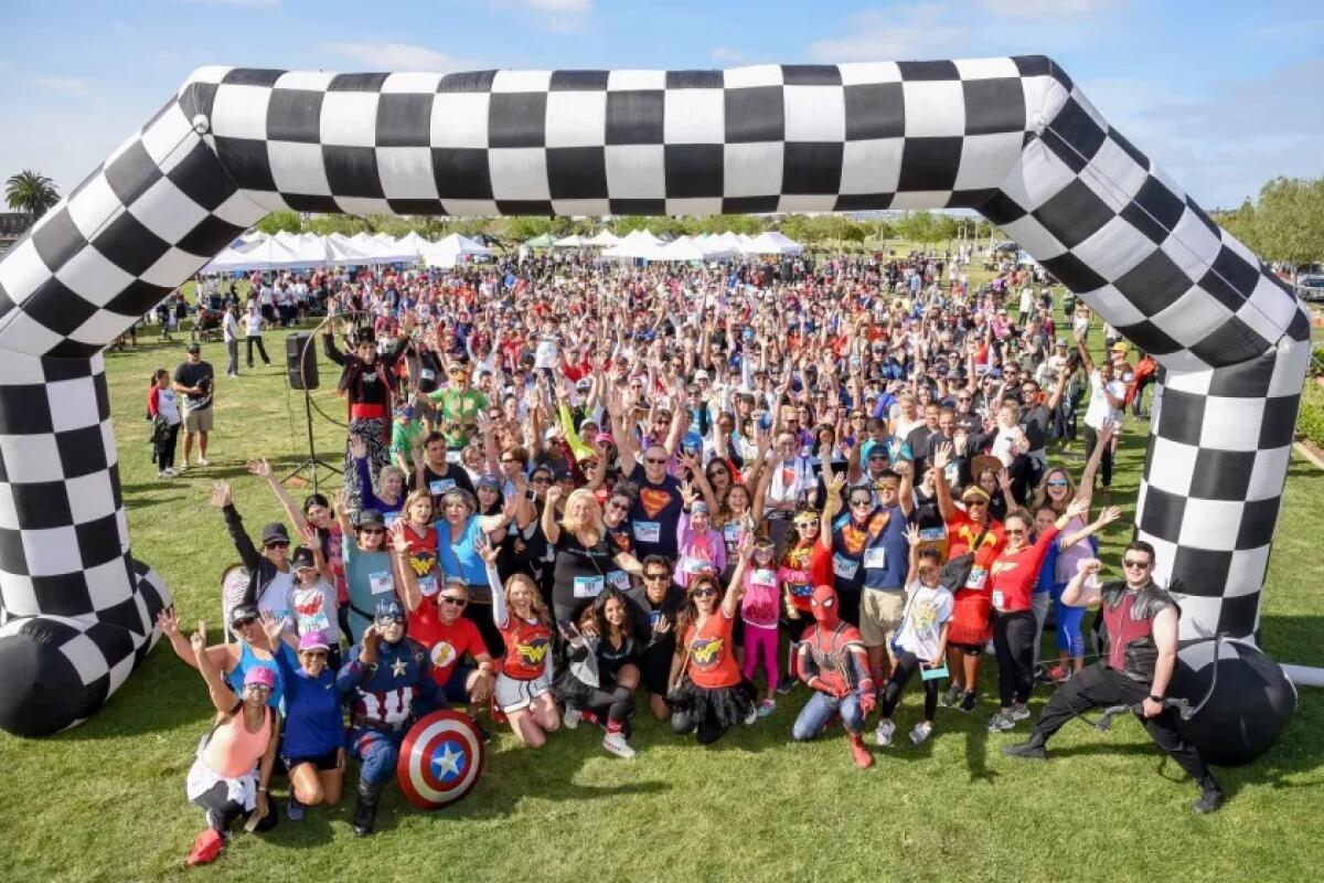 TParticipants at a past Miracle Babies Superhero 5K event.