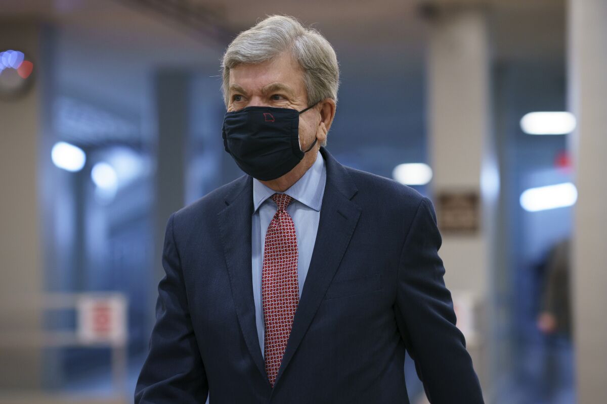 A closeup of Roy Blunt, wearing a mask. 