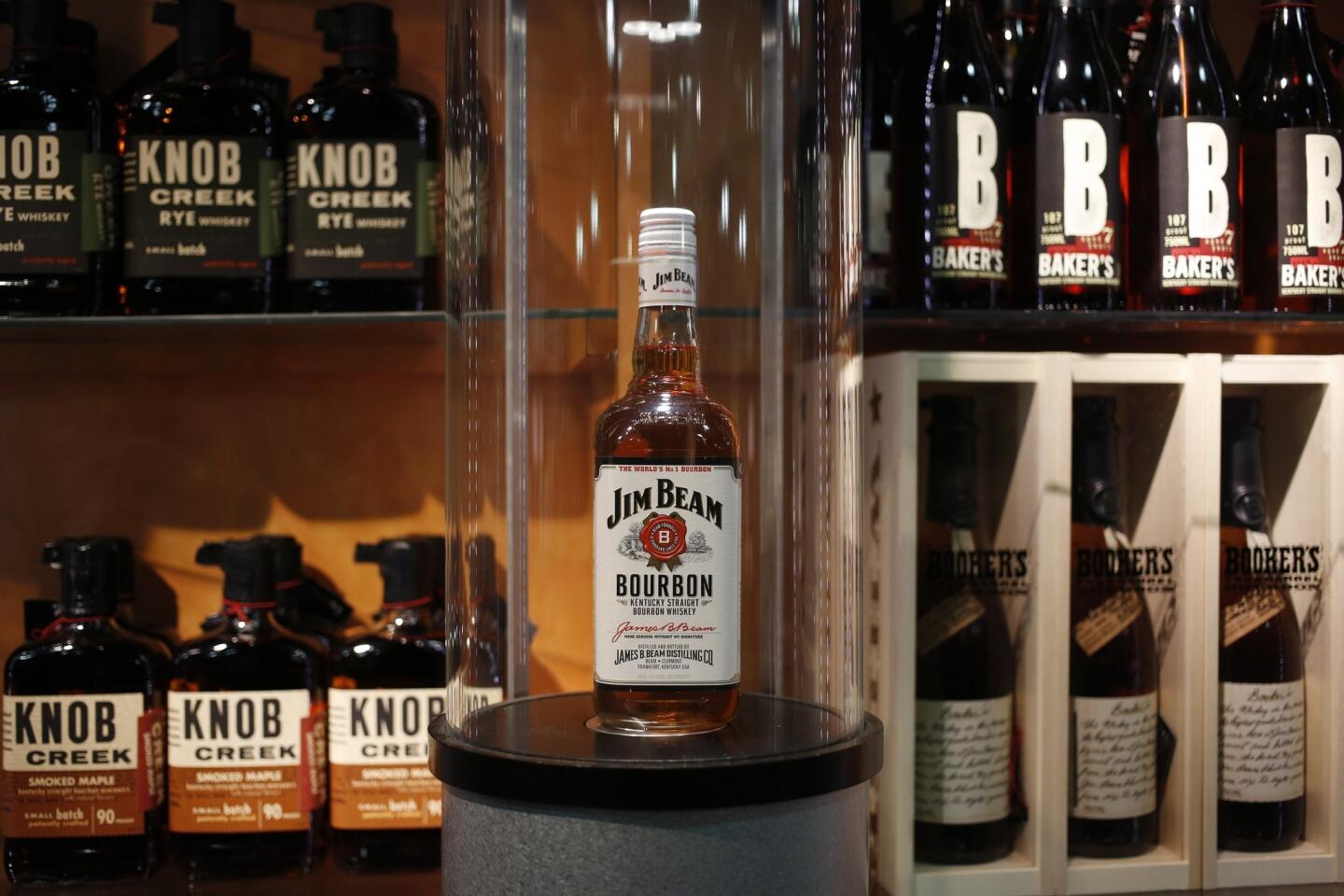 Bottles of Jim Beam Bourbon are displayed for sale inside the gift shop at the Jim Beam bourbon distillery. Japanese company Suntory Holdings recently acquired Beam Inc. for $13.6 billion.