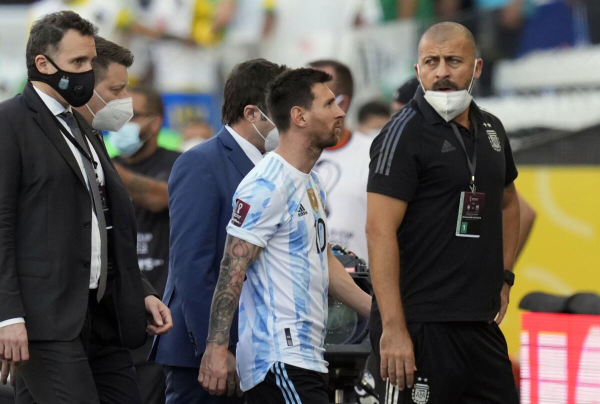 Argentina's Lionel Messi walks off the field after the qualifying soccer match for the FIFA World Cup Qatar 2022 against Brazil was interrupted by health officials in Sao Paulo, Brazil, Sunday, Sept. 5, 2021. (AP Photo/Andre Penner)