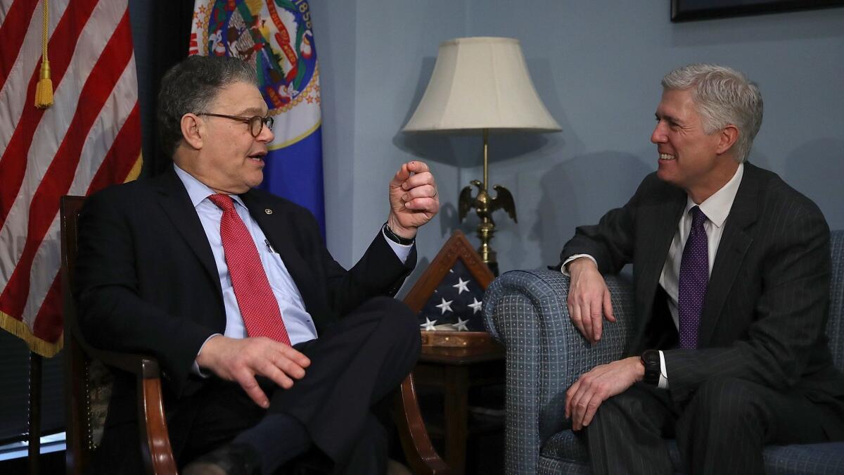 U.S. Supreme Court nominee Judge Neil Gorsuch, right, meets with U.S. Sen. Al Franken (D-Minn.) in Franken's office on Capitol Hill.