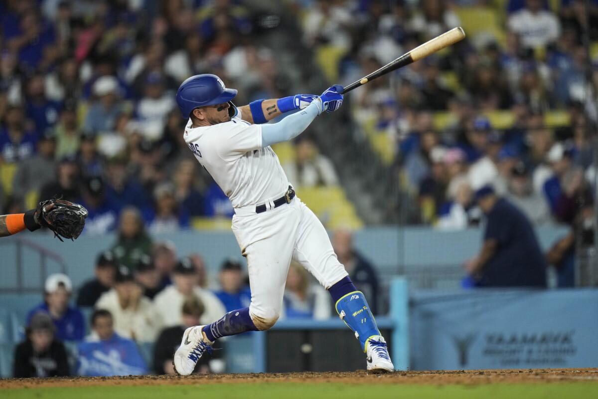 Miguel Rojas hits for the Dodgers.