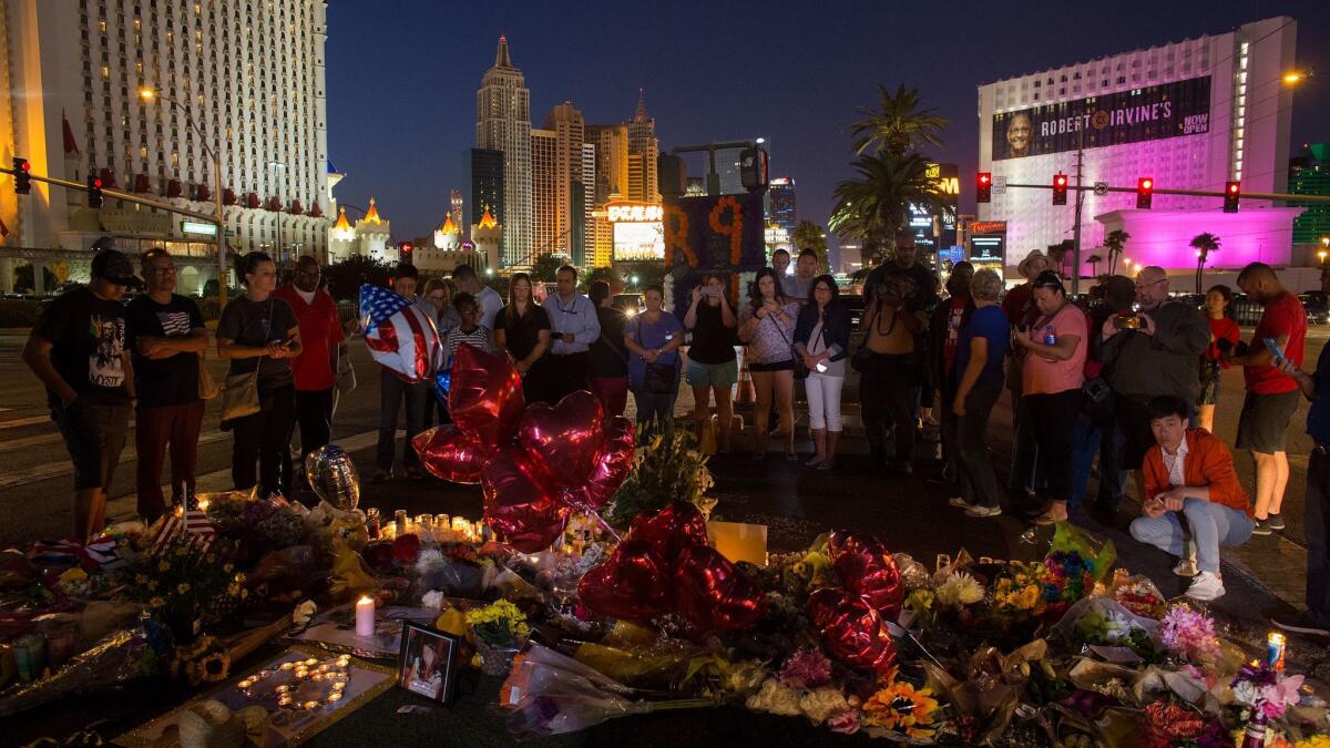 A crowd gathers Wednesday night to pay tribute to victims of the mass shooting in Las Vegas.
