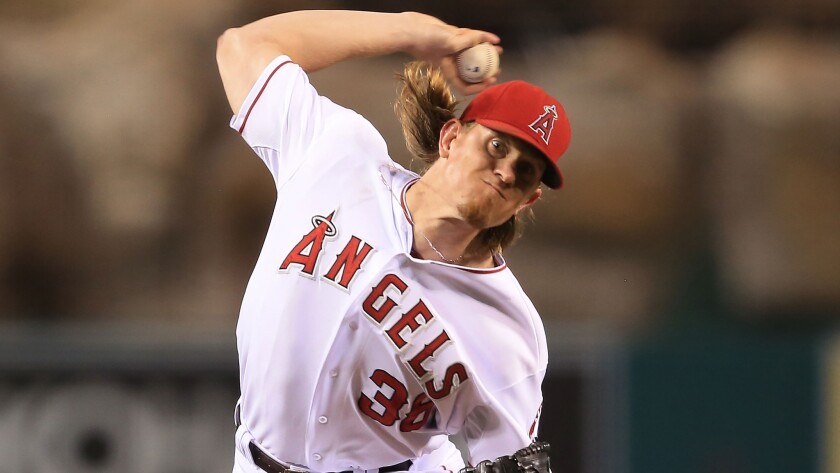 Angels starter Jered Weaver delivers a pitch against the Texas Rangers on Sept. 20. Weaver will start Thursday against the Kansas City Royals in Game 1 of the American League division series.